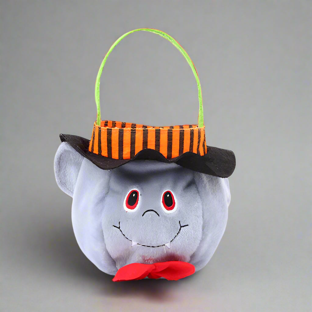 Halloween-themed plush toy with a striped bucket on a white background