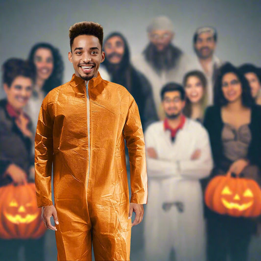 Man in an orange jumpsuit standing outdoors with a group of people sitting on a patio.