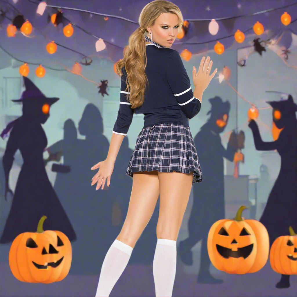 Person wearing a schoolgirl costume with a navy top, plaid skirt, white stockings, and black high heels on a white background.