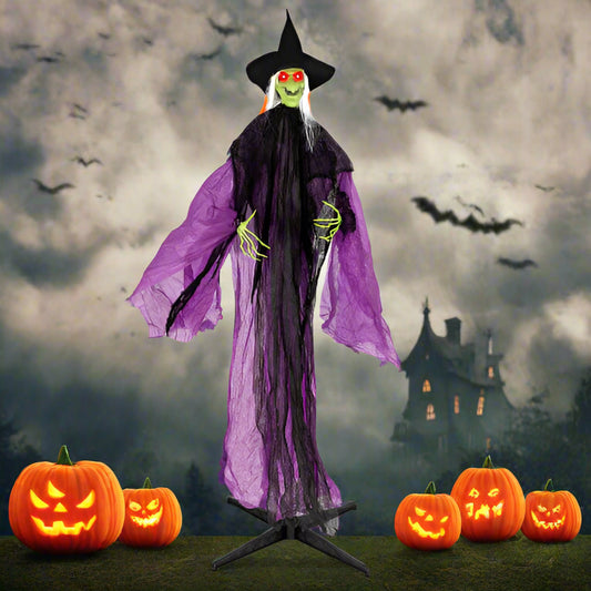 Halloween witch decoration with purple cape and black hat on a stand.