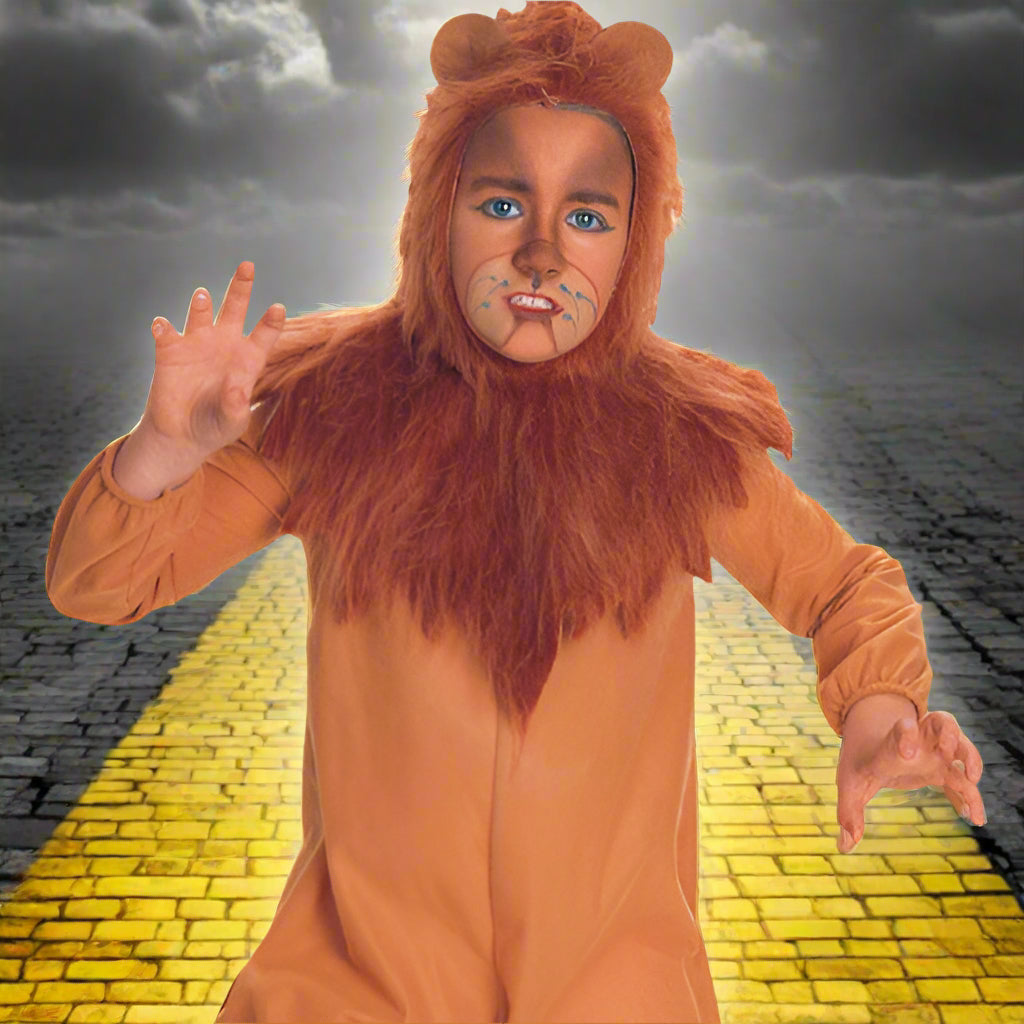 Child wearing a lion costume with a white background